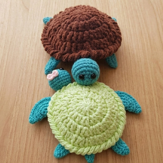 Crocheted turtle toy on a wooden surface