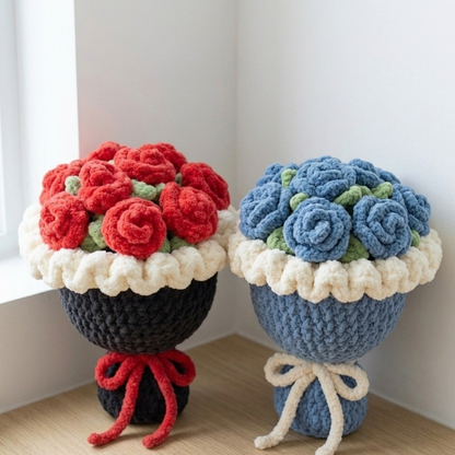 Two knitted flower bouquets, one red and one blue, on a light wooden floor.