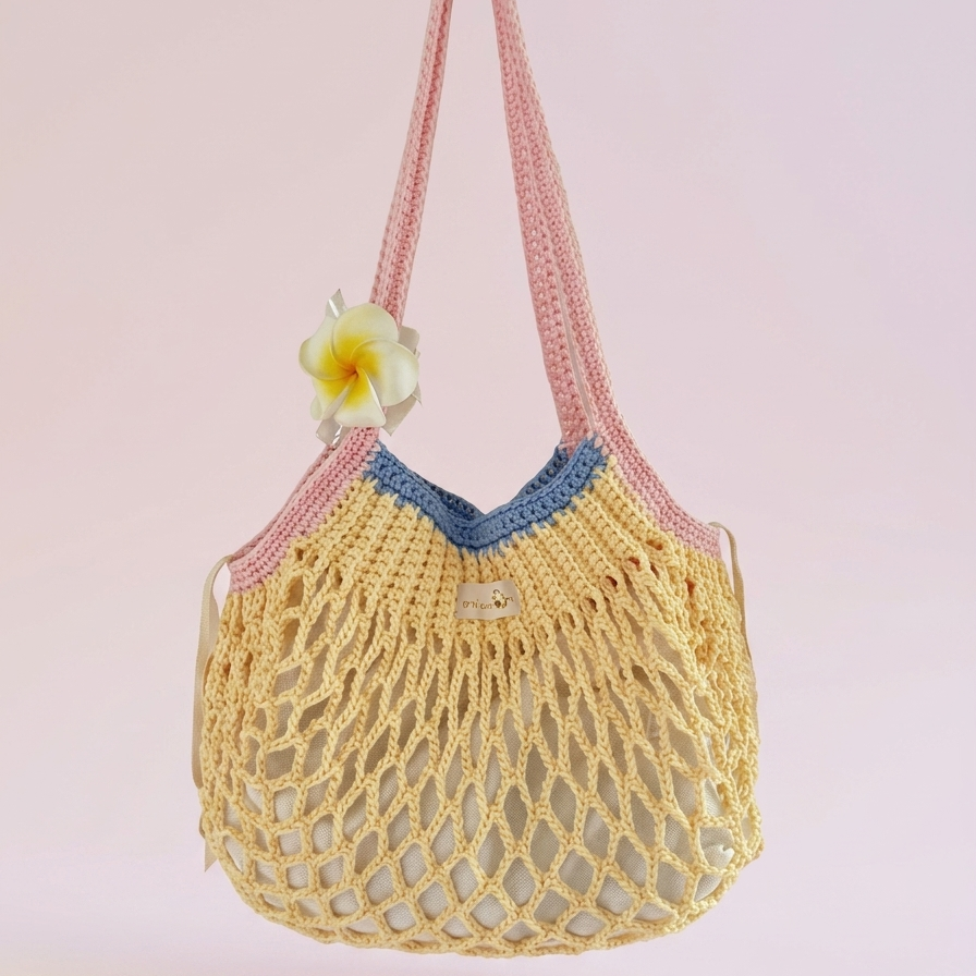 Handmade mesh tote bag crochet pattern with soft summer colors