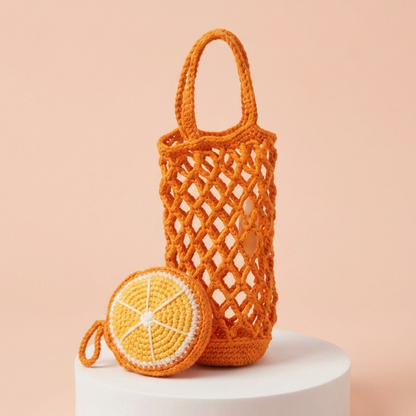 orange crochet mesh bottle bag with lemon coaster charm pattern