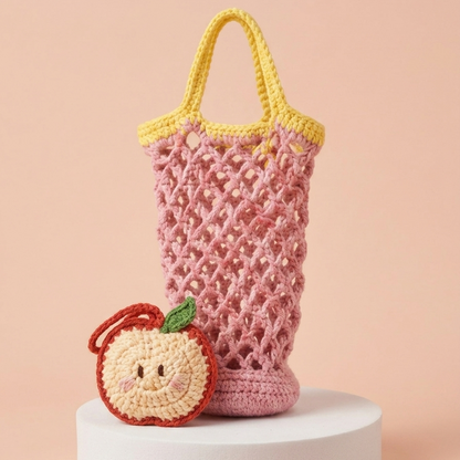 pink crochet mesh water bottle bag with apple charm pattern